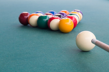 Focus on cue aiming white ball to break snooker billards
