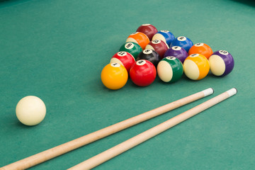 Snooker billards pool balls and cue stick on green table