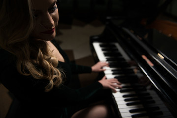Fototapeta na wymiar Girl Playing the Piano