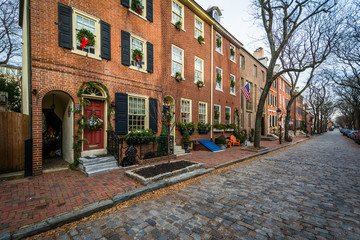 Historic brick buildings and cobblestone street in Society Hill,