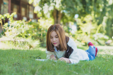 woman reading a book in the garden