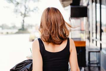 Fototapeta premium Back view of the young female with beautiful blond