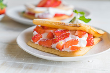 waffle with strawberry on wood