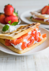 waffle with strawberry on wood