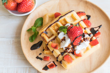 waffle with strawberry on wood