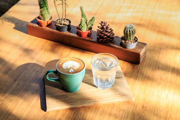 Latte art coffee on wood background