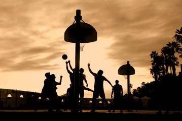 Basketball players at sunset - Powered by Adobe