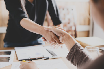 Negotiating business,Image businesswomen handshake,happy with work,business woman she is enjoying...