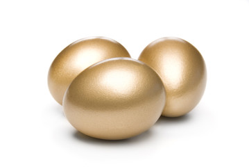 Golden eggs on a white background