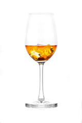 Glass of scotch whiskey and ice on a white background