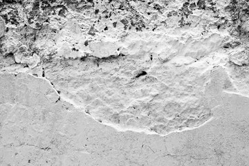 Wall fragment with scratches and cracks