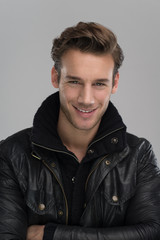 portrait of a young guy over gray background