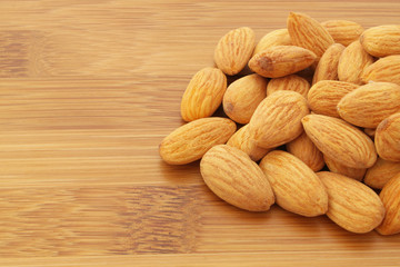 Almonds on wooden background