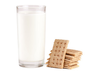 glass of milk with stack of grain crispbreads isolated on white background