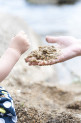 Little girl playing with sand