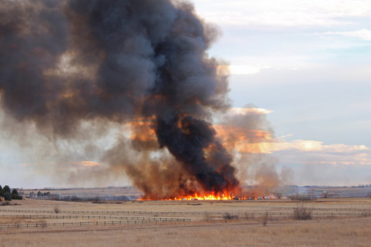 A Wildfire In Colorado Produces A Plume Of Black Smoke Rising Into The Sky.