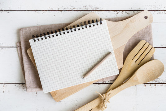 Blank notebook with wooden utensil