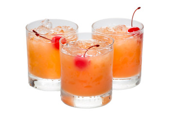 Three glasses with orange coctails in it close-up