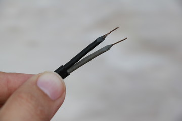 Power cable exposing strands of copper wires