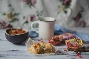tea, fruit, fabric on wooden background