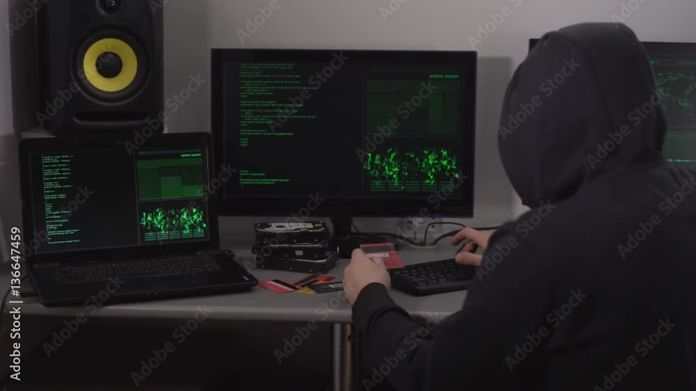 Poster villain hacker gains access to bank accounts using a credit card customers and special software on a