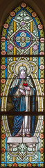 Fototapeta na wymiar BANSKA STIAVNICA, SLOVAKIA - FEBRUARY 5, 2015: The St. Therese of Lisieux on the windowpane in st. Elizabeth church from 19. cent.