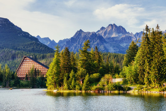 The sunrise over a lake in the park High Tatras. Shtrbske Pleso,