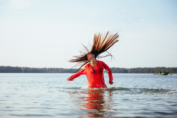 blonde woman on water background