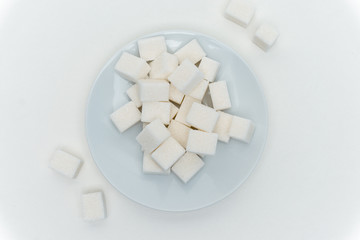 Fototapeta na wymiar sugar cubes on the table, marshmallows, white sweetness