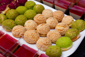 Tray with delicious cakes and macaroon
