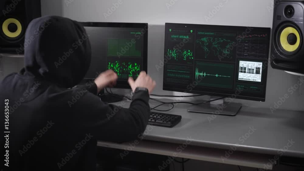 Poster back view of a hooded angry hacker in black making cyber attack on bank network and failuring the pr