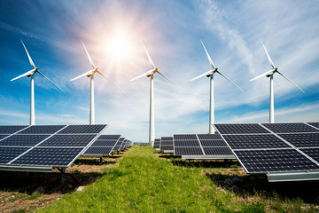 Photo collage of solar panels and wind turbins - concept of sustainable resources