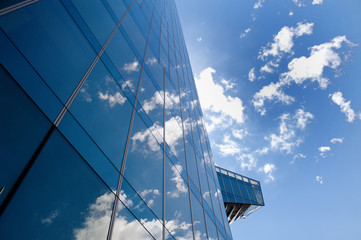Fototapeta premium Business office building, clouds and sky in Barcelona, Spain