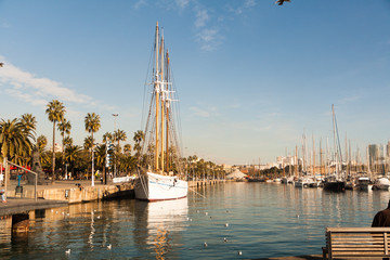 Sailboat in the old port of Barcelona on a sunny morning