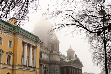 St. Isaac's Cathedral in the fog through the branches of a tree.