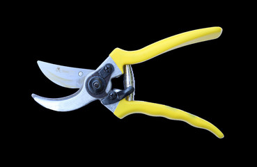 Gardening scissor isolated on black background