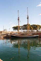 Sailboat in the old port of Barcelona on a sunny morning