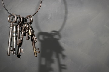 Old vintage key on rustic background