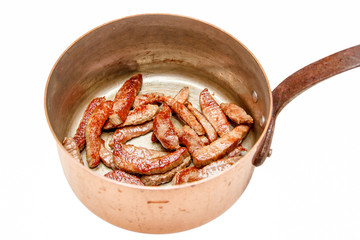 Slices of raw beef are roasted on a steel pan. Insulated.