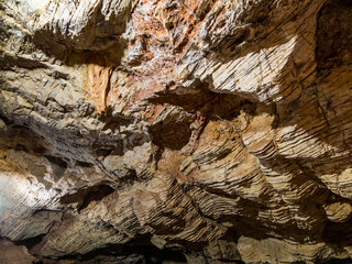 Rocky pattern in tranquil cave in deep forest