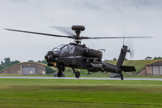 Apache AH1 gunship lands on the grass