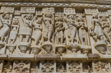 sculptural relief with the image of living beings
