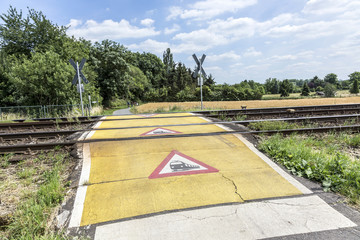 Fototapeta premium train warning sign at a railroad crossing