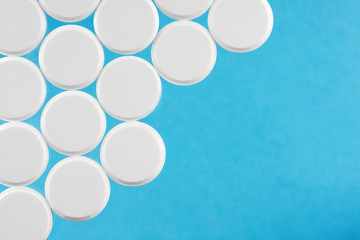 Modern white medical pills on medical background