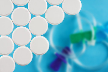 Modern white medical pills on medical background