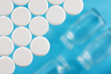 Modern white medical pills on medical background