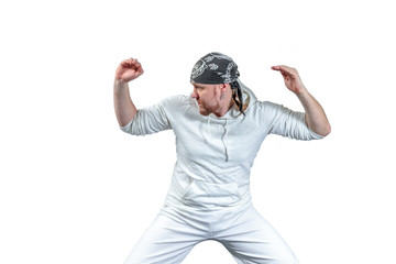 Athlete shows capoeira techniques with dark bandana on his head