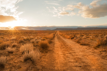 Unpaved road through Grand Staircase Escalante National monument in Utah - Powered by Adobe