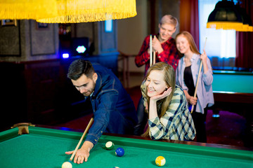 Fototapeta premium friends playing billiard