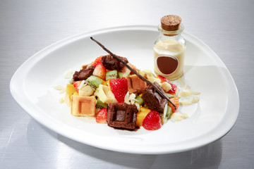 Waffles and fruit salad.